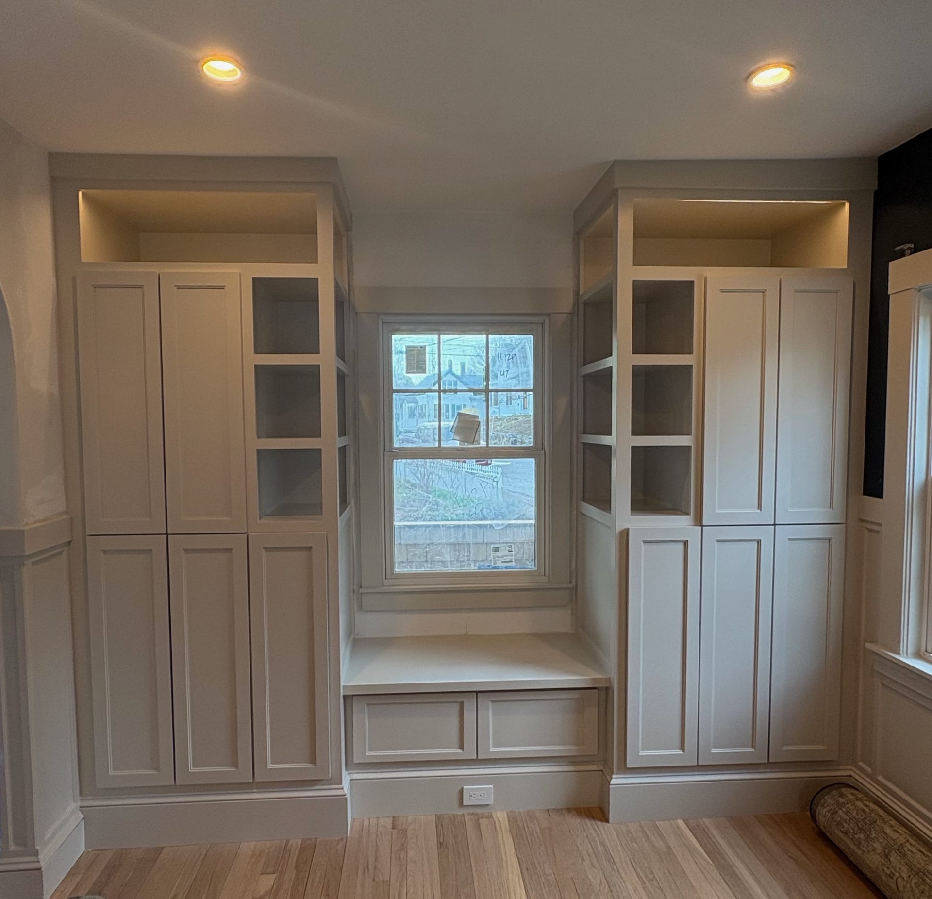 Custom built-in shelving unit flanking living room fireplace