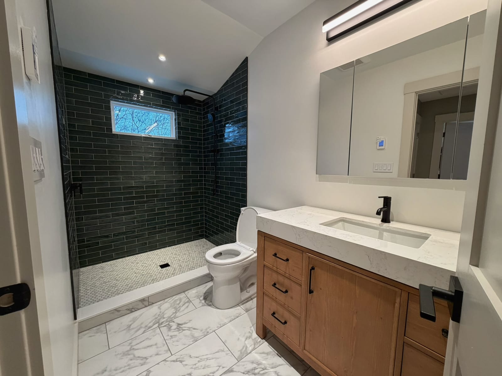 Elegant bathroom with marble tile and modern fixtures