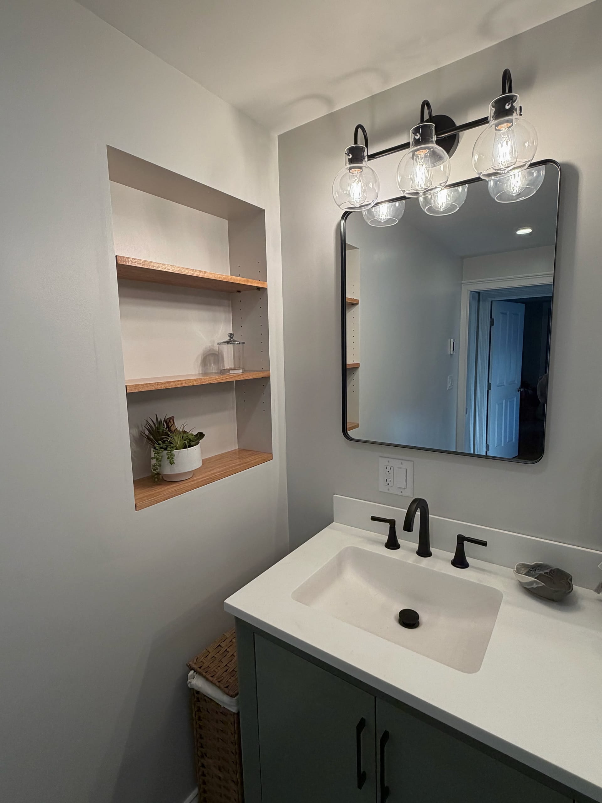 Bright marble bathroom with bathtub and glass shower panel
